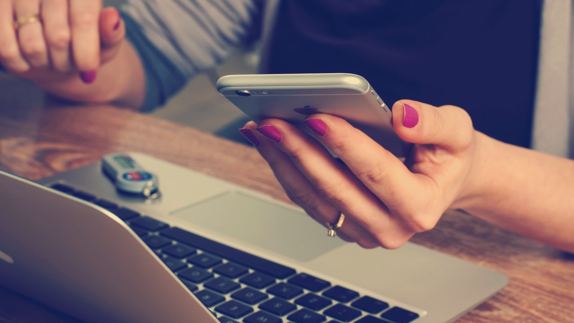 woman holding silver iPhone 6